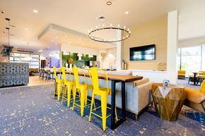 Gilbert apartment for rent - a dining room with yellow chairs and a table