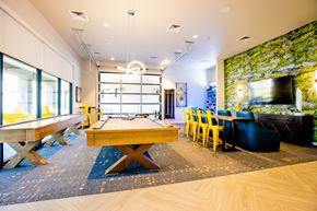 Gilbert apartment for rent - Studio Apartments in Gilbert AZ - Curve at Gilbert - The game room, featuring a pool table, shuffleboard, and television with comfortable seating