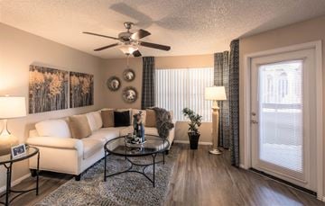 Phoenix apartment for rent - a living room with a couch and a ceiling fan