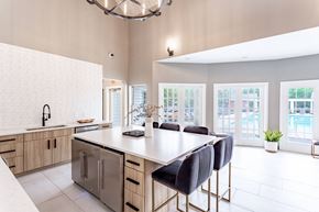 Bloomington apartment for rent - a kitchen with a large island and a chandelier