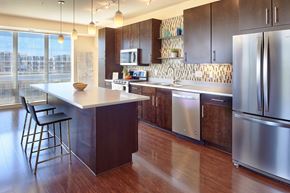 Minneapolis apartment for rent - a large kitchen with stainless steel appliances and a counter top