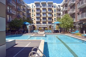 Minneapolis apartment for rent - an apartment swimming pool with an apartment building in the background
