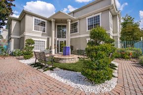 Houston apartment for rent - Luxury One-Bedroom Apartments in Houston, TX - The Maroneal - Exterior View of the Leasing Office with Benches, a Fountain, and Beautiful Landscaping
