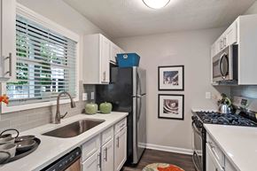 Atlanta apartment for rent - Glen Lake Apartments in Atlanta, GA 30328 photo of a kitchen with white cabinets