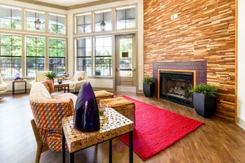 Resident clubhouse with an internet café and cozy fireplace