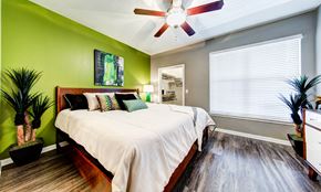 Austin apartment for rent - bedroom with large window and ceiling fan