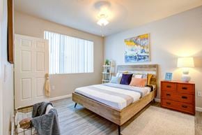 Phoenix apartment for rent - Apartments For Rent In North Phoenix, AZ - Ironhorse at Tramonto - Spacious Bedroom With Vinyl Plank Flooring, Large Window, And Ceiling Light.