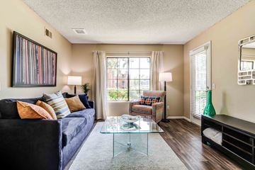 San Diego apartment for rent - a living room with a couch and a glass coffee table