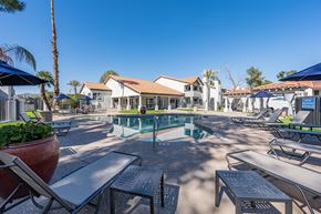 Phoenix apartment for rent - Apartments in Ahwatukee, AZ - Pacific Bay Club - Outdoor Resort-Style Swimming Pool with Sundeck, Lounge Seating, and Umbrella Tables.