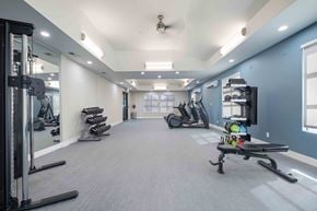 San Jose apartment for rent - A spacious gym with a variety of equipment including treadmills, stationary bikes, and weight machines.