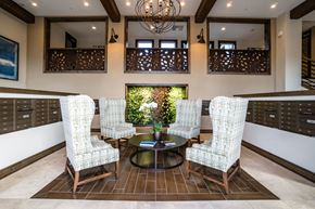 Santa Clara apartment for rent - Santa Clara, CA, Apartments for Rent - Villas on the Boulevard - Clubhouse Seating Area with Four Sitting Chairs, Coffee Table, Chandelier Lighting, and Mail Boxes.