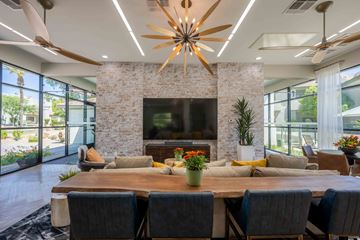 Phoenix apartment for rent - a living room with a table and chairs and a fireplace
