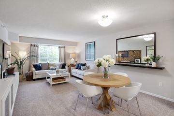 Woodbury apartment for rent - a living room with a table and chairs and a couch