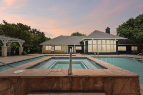 Round Rock apartment for rent - A house with a pool in front of it.