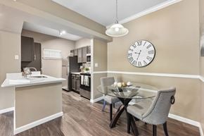 Round Rock apartment for rent - A dining room with a glass table and chairs.