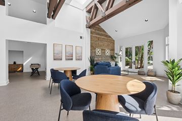 San Clemente apartment for rent - A living room with a wooden table surrounded by chairs.