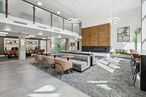 Seattle apartment for rent - A modern office space with a long table and chairs.