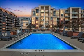 Arlington apartment for rent - A large swimming pool in front of apartment buildings with a "No Diving" sign.