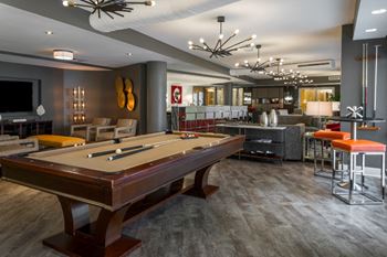 Multimedia clubroom with billiards, bar for entertaining, and ipad® docking station