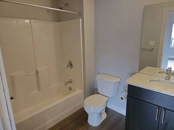 Shower/tub combo with shower rod