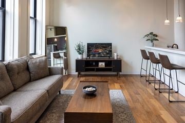 St. Louis apartment for rent - a living room with a couch and a coffee table