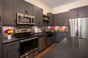 Olivette apartment for rent - Dark Kitchen finishes  at The Clover at Olive Crossing in Olivette, MO