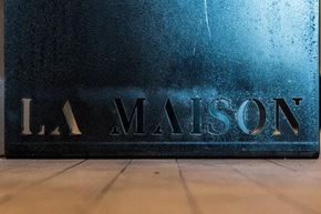 St. Louis apartment for rent - A blue sign with the word "LA MAISON" on it.