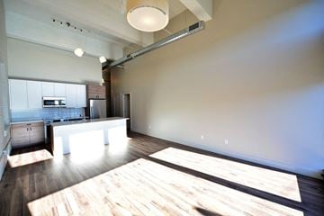St. Louis apartment for rent - a large living room with a kitchen and a table