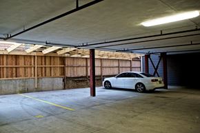 St. Louis apartment for rent - A white car is parked in a garage.