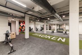 St. Louis apartment for rent - A gym with a green floor mat that says