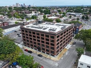 St. Louis apartment for rent - an aerial view of a brick building with a white roof