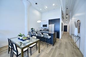 St. Louis apartment for rent - a dining room and kitchen with a table and chairs