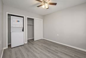 Kansas City apartment for rent - Bedroom with a washer and dryer in the corner