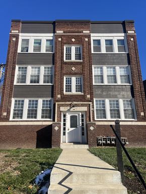 Kansas City apartment for rent - the front of a brick building with a white door