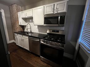 Kansas City apartment for rent - Kitchen with gas stove, microwave, sink