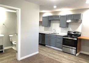 Kansas City apartment for rent - A kitchen with a stove, oven, and cabinets.