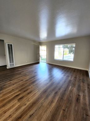 Sunnyvale apartment for rent - an empty living room with wooden floors and a window