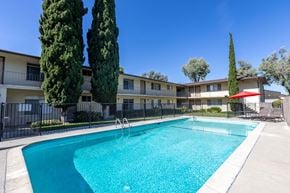 Sunnyvale apartment for rent - a swimming pool in front of an apartment building with a pool