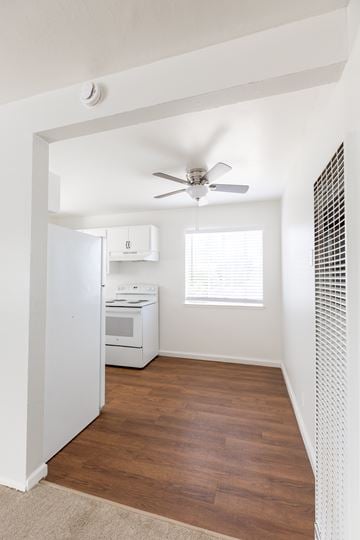 San Mateo apartment for rent - A kitchen with a white fridge, stove, and dishwasher.