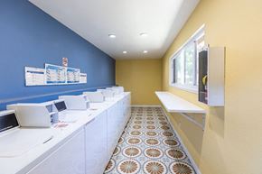Gilroy apartment for rent - A row of white washing machines in a laundromat.
