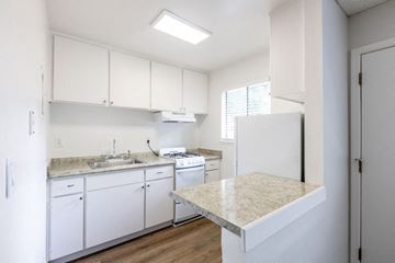 San Jose apartment for rent - a kitchen with white cabinets and a counter top