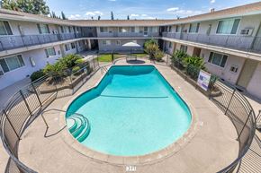 Campbell apartment for rent - a resort style pool is in the middle of an apartment building