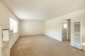 Campbell apartment for rent - an empty living room with an open door to a hallway and a bedroom with a