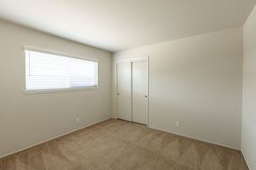 Campbell apartment for rent - a bedroom with a door and a window and a carpeted floor
