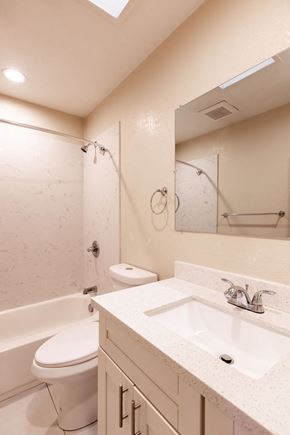 Santa Clara apartment for rent - A white bathroom with a toilet, sink, and bathtub.