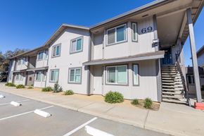Salinas apartment for rent - Apartment building number 69 with a parking lot in front.