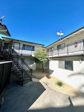 Santa Clara apartment for rent - A sunny day at a residential complex with a clear blue sky.