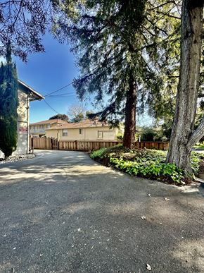 Mountain View apartment for rent - a house with a driveway and trees in front of it