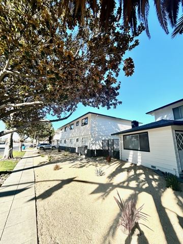 Santa Clara apartment for rent - A sunny day in a residential area with houses and trees.