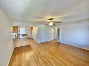 Sunnyvale apartment for rent - A room with wooden floors and a ceiling fan.